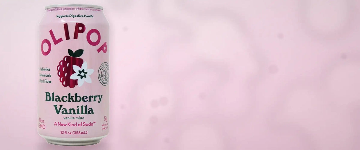 Pink aluminum can of olipop blackberry vanilla soda with a raspberry and flower graphic.